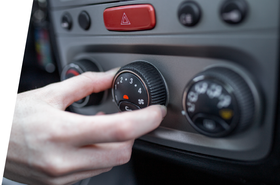 photo of a person using the climate control dial in their vehicle before car ac repair