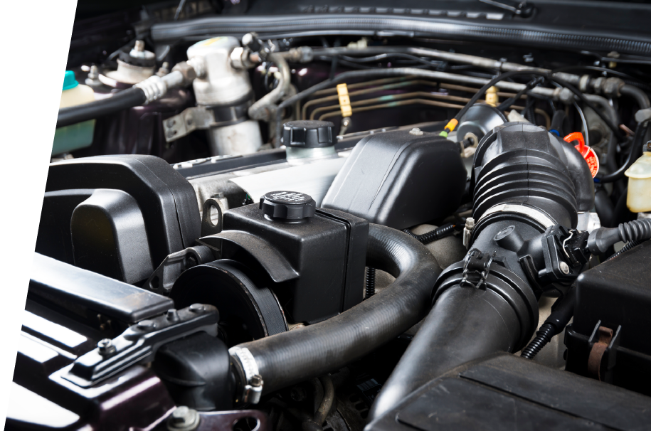 photo of the inside of an engine bay showing various tubing and wiring