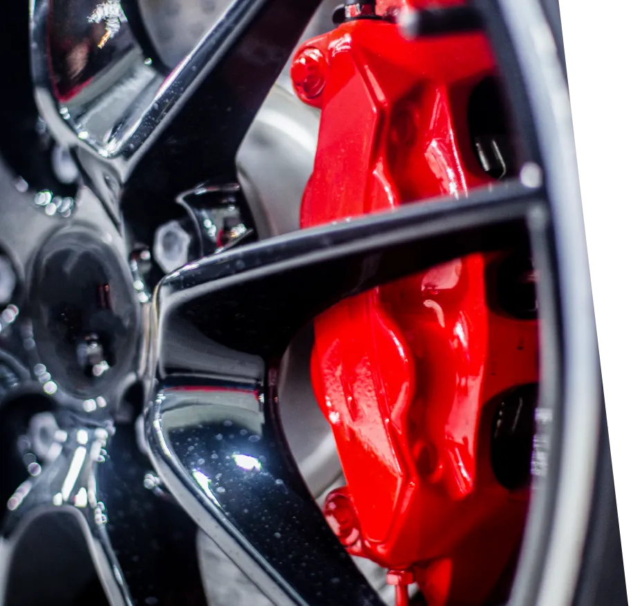 closeup photo of a car wheel with red brakes after a brake repair