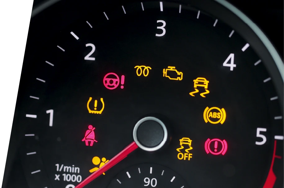 photo of a cluster of car warning lights on a car dashboard