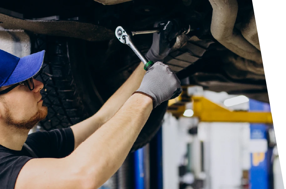 photo of a car service technician performing a vehicle inspection