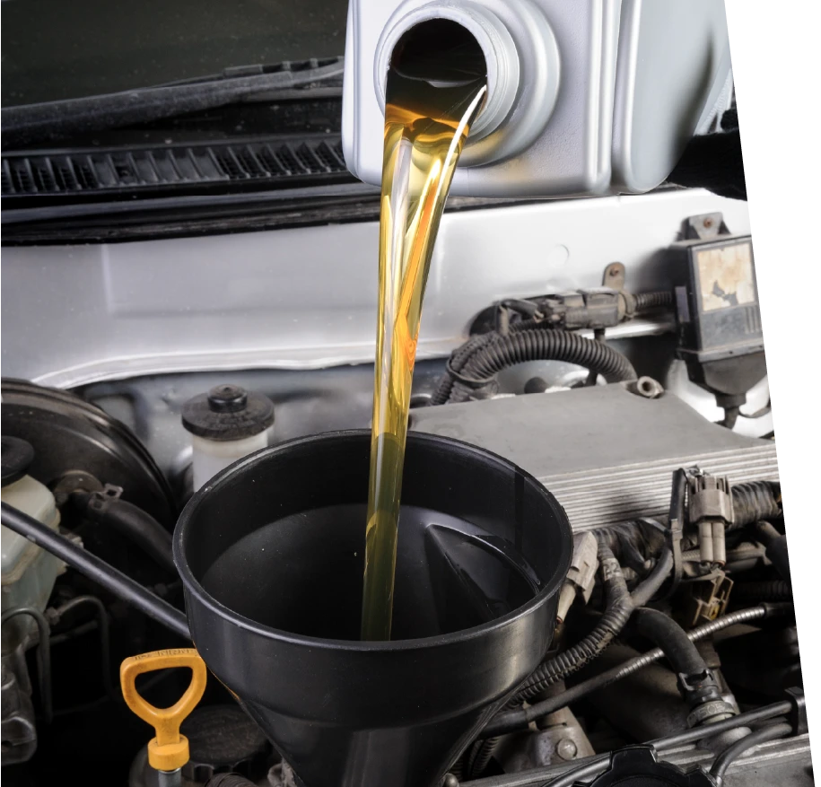 photo of oil being added to a car during a synthetic oil change