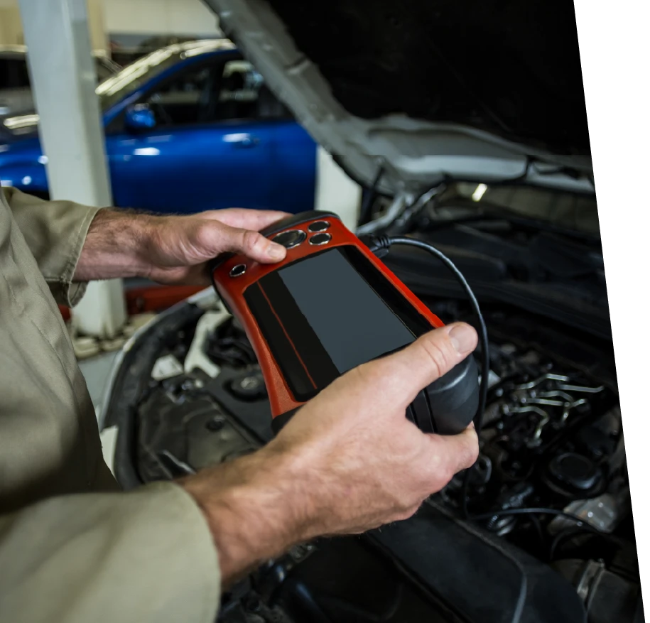 car service technician using a specialized diagnostic tool to find the root cause of car warning lights
