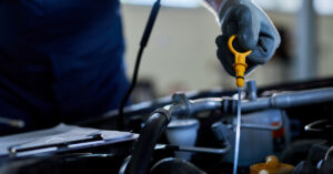photo of a mechanic demonstrating how often should you change your oil