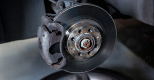 photo of car brakes and rotor during a brake fluid maintenance