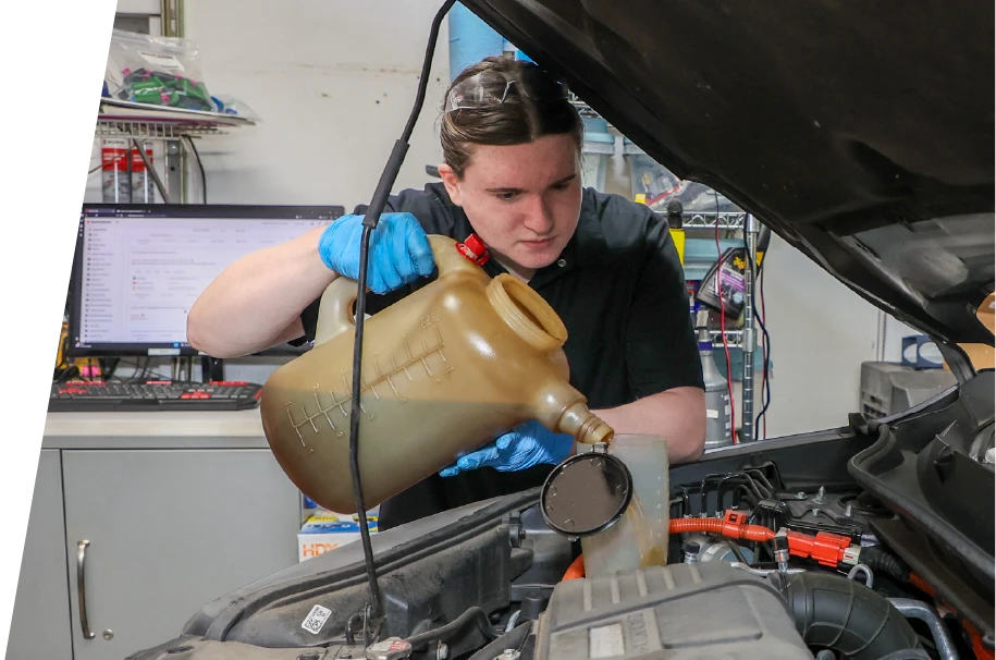 photo of a technician performing a synthetic oil change