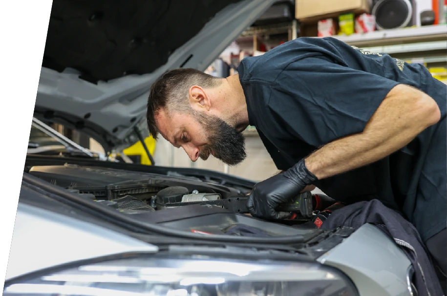 photo of a service technician reviewing car diagnostics